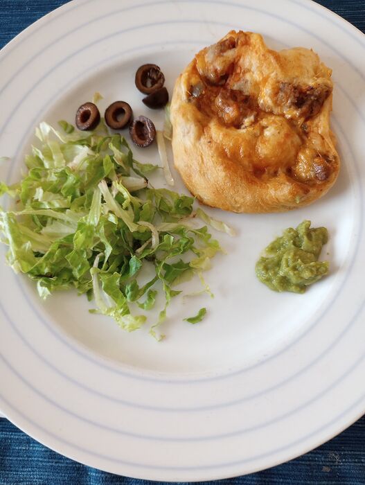 Nov 26 lunch taco  crescent pinwheels with guac, ripe olives, shred lettuce